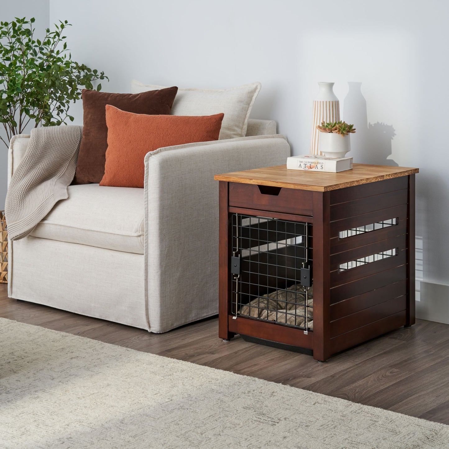 Table pet crate in living room with items on top