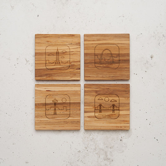 An overhead view of the entire US landmark themed all day every day coasters each one featuring a different landmark. One features the Chrysler building, one the space needle, one the golden gate bridge and the other the Arch.
